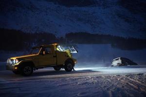 Car being towed after accident in snow storm photo