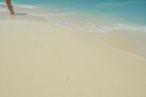 footsteps on beach photo