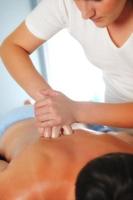 back massage at the spa and wellness center photo