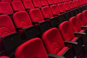 hall with rows of red seats photo