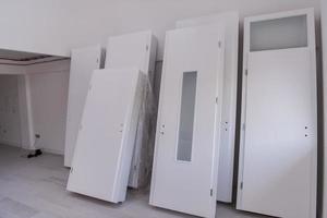 Interior doors stacked in a new apartment photo