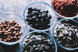 Superfoods in transparent glass bowls. photo