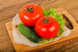 Cucumbers and tomatoes photo