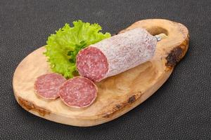 Italian dry Saliami pork sausage photo