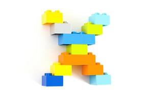 Colorful toy brick letter X photo