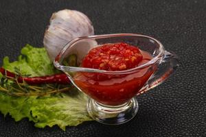 Spicy tomato and garlic sauce photo