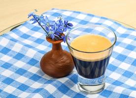 Espresso with spring flower photo