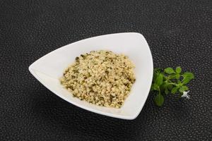 Peeled hemp seeds in the bowl photo