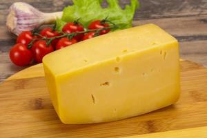 Hard yellow tasty cheese brick photo