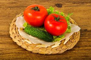 Cucumbers and tomatoes photo