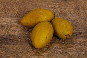 Exotic tropical fruit - Sapodilla in the plate photo