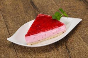 Soft Raspberry cheesecake served mint photo