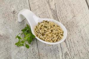 Peeled hemp seeds in the bowl photo