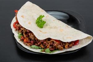 Burrito with minced meat and beans photo