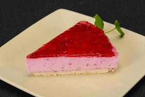 Soft Raspberry cheesecake served mint photo