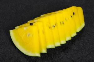 Sliced sweet tasty yellow watermelon photo