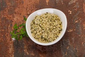 Peeled hemp seeds in the bowl photo