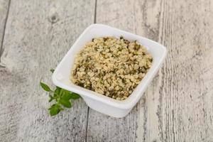 Peeled hemp seeds in the bowl photo