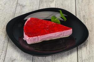 Soft Raspberry cheesecake served mint photo