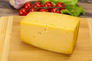 Hard yellow tasty cheese brick photo