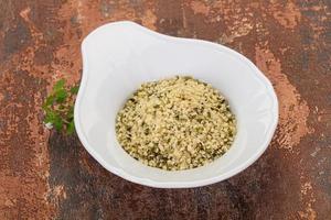 Peeled hemp seeds in the bowl photo