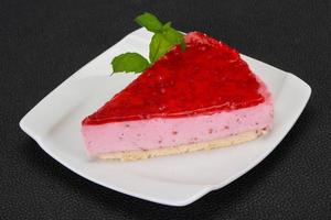 Soft Raspberry cheesecake served mint photo