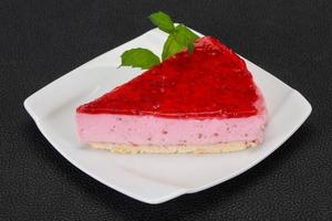 Soft Raspberry cheesecake served mint photo