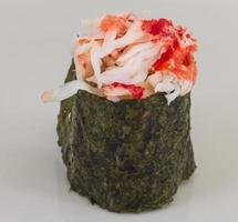 sushi kani with sauced slices of crab shrimp isolated on white background photo