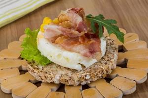 Crispy sandwich with egg and bacon photo