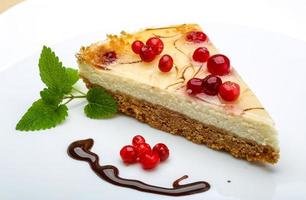 Cheesecake with berries and mint photo