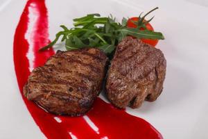 Beef steak with berry sauce photo