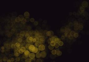 Golden yellow bokeh background  There is a sparkle of lights, Christmas and New Year party ideas. photo