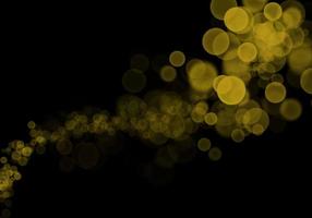 Golden yellow bokeh background  There is a sparkle of lights, Christmas and New Year party ideas. photo