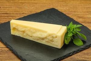 Hard parmesan cheese served basil photo