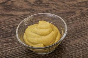 Dijon mustard sauce in the bowl photo