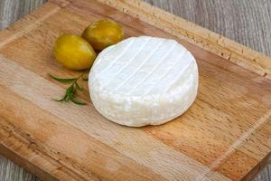 Whole brie cheese photo