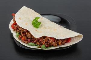 Burrito with minced meat and beans photo