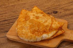 Homemade caucasian cheburek with meat photo