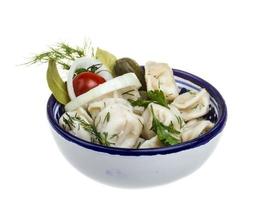 Bowl with traditional russian dish - pelmeni photo