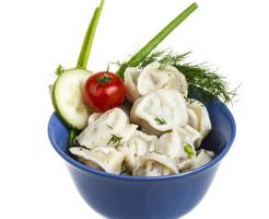 Bowl with traditional russian dish - pelmeni photo