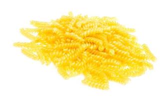 pile of fusilli pasta close up on wood background photo