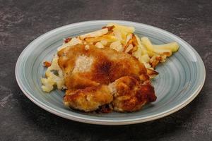 Pork schnitzel with roasted potato photo