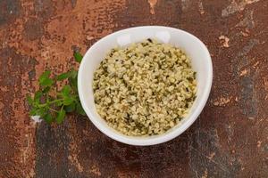 Peeled hemp seeds in the bowl photo