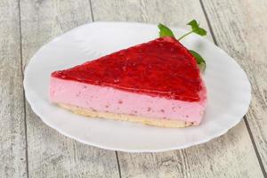 Soft Raspberry cheesecake served mint photo