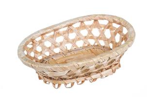 Wickerwork empty yellow breadbasket on white background photo