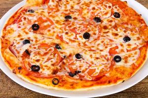 Margarita pizza with olives photo