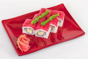 Maki Sushi - Roll made of Crab, avocado, cucumber inside. Fresh Tuna and tobico roe outside photo