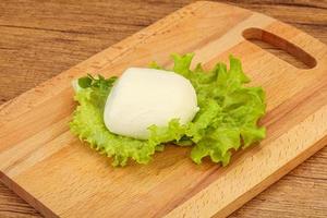 Italian Mozzarella cheese over board photo