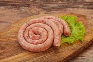 Raw sausage ring for grill photo