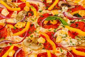 Pizza with salami and mushrooms photo